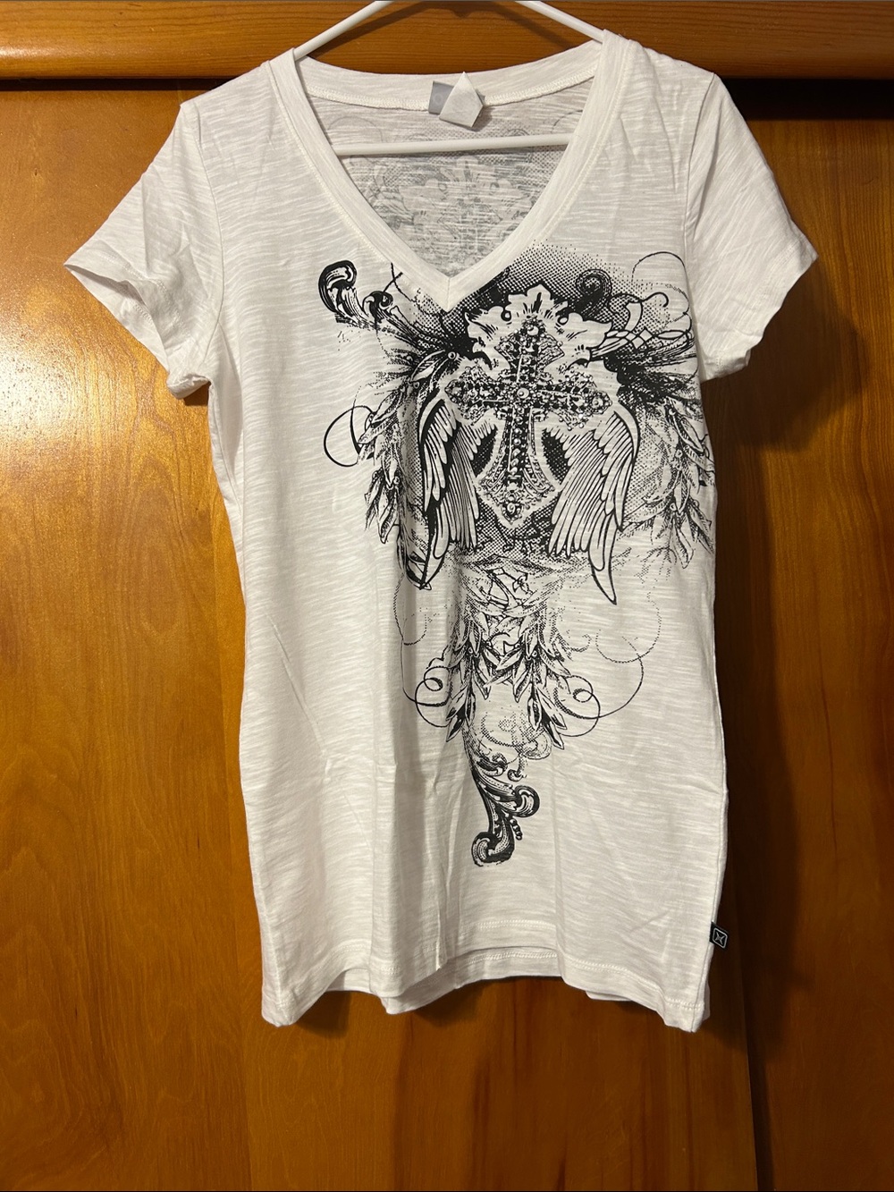 Women’s White V-Neck Graphic Tee with Black Cross and Wings